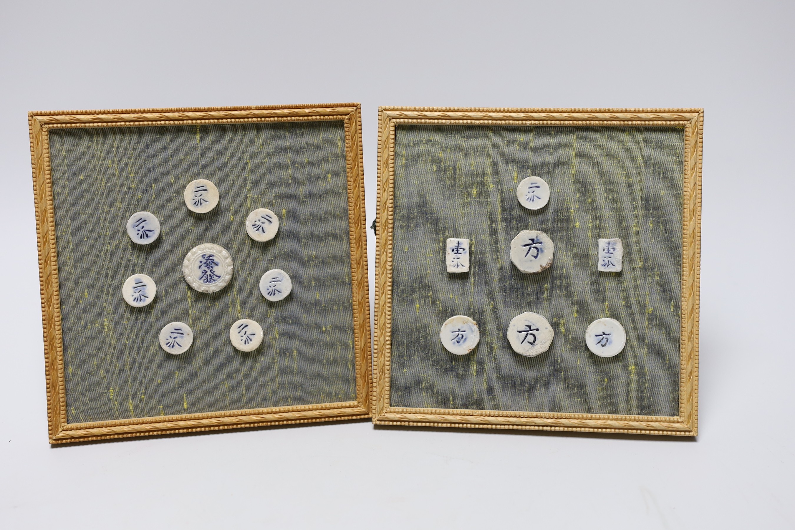 Five 19th century Chinese blue and white stem cups and two framed sets of Thai gaming counters, tallest cup 11cm